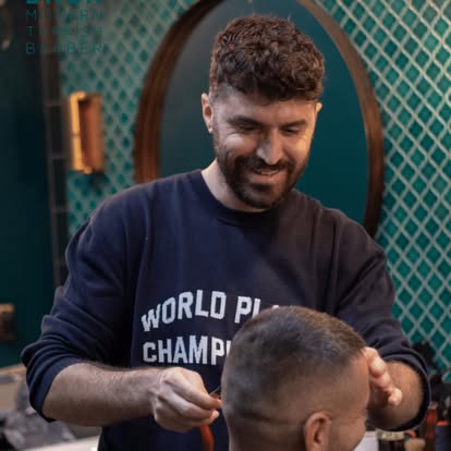 One of the brothers at Baba Barbers