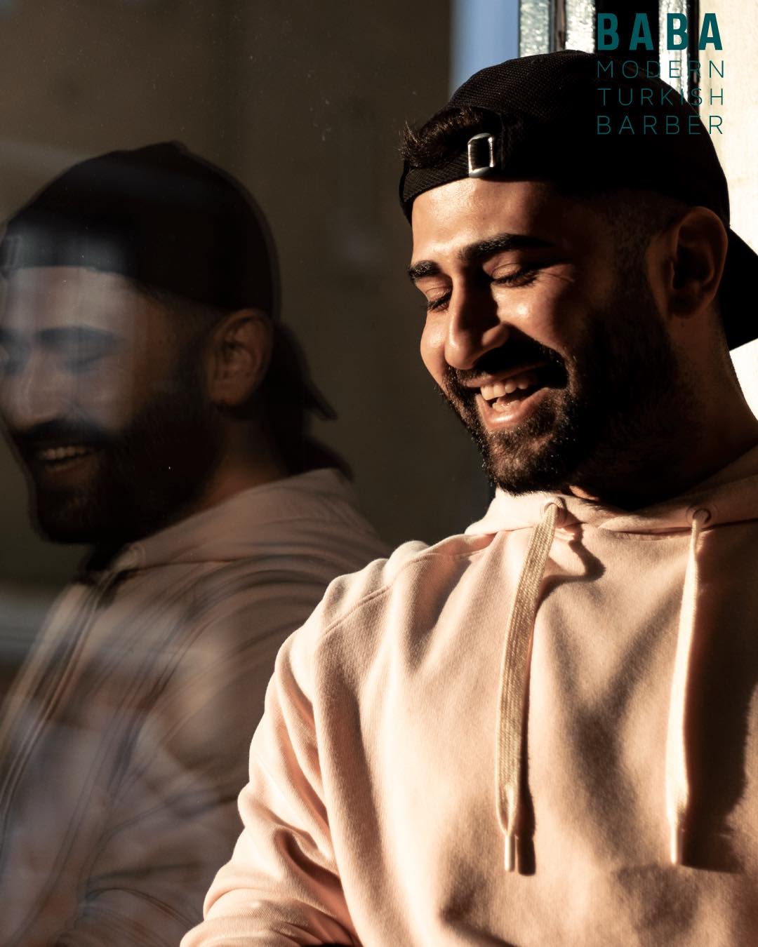 One of the brothers at Baba Barbers