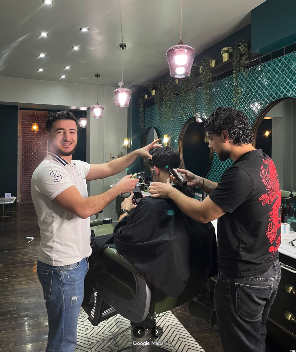 Barbers at work smiling