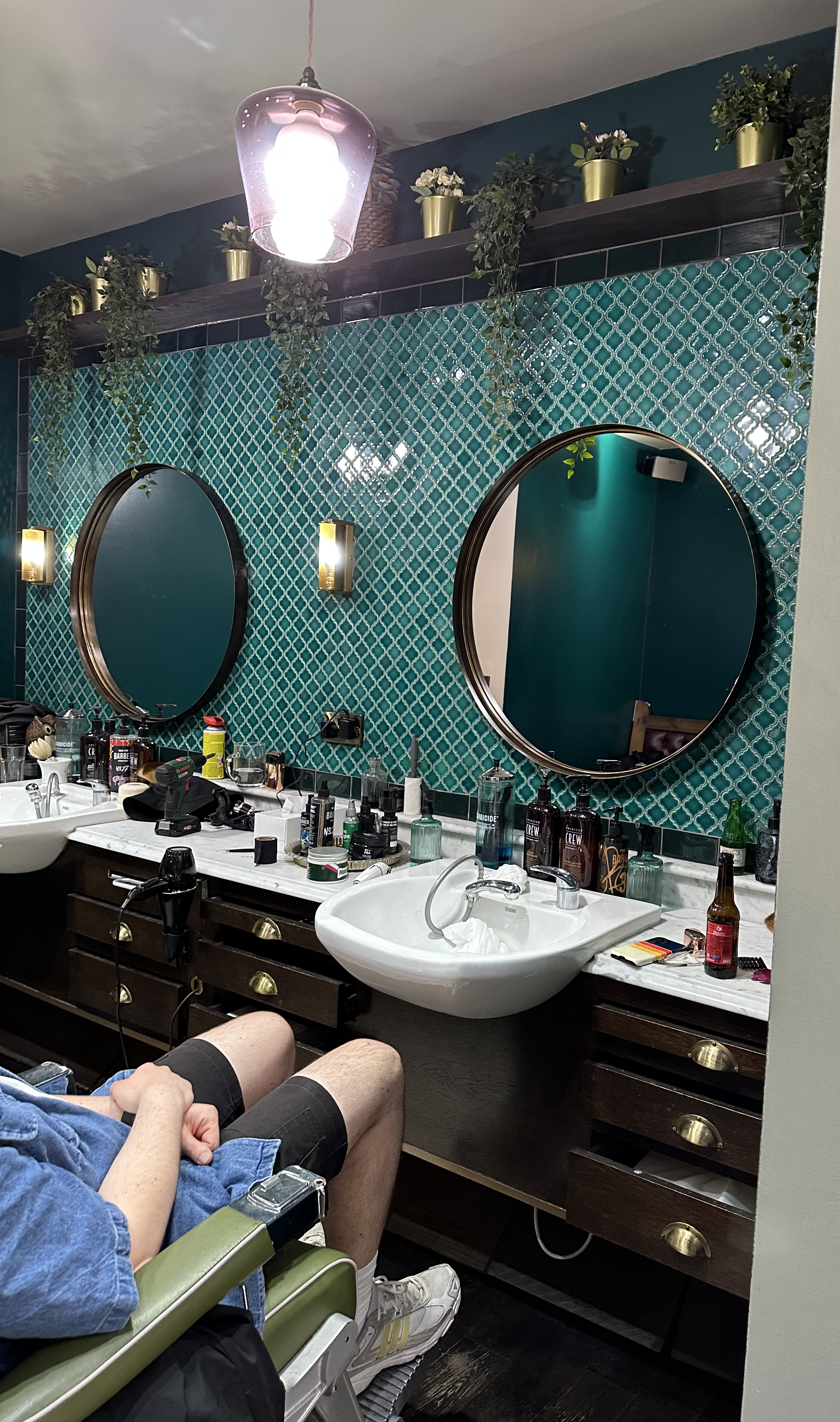 Oval mirrors at Baba Barbers