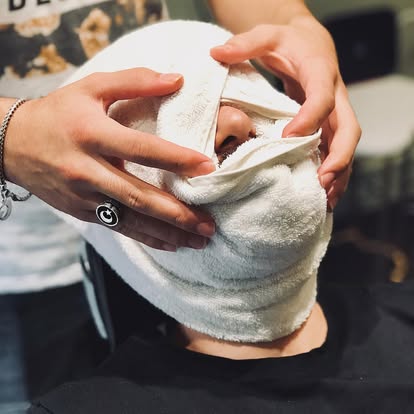 Hot towel on face